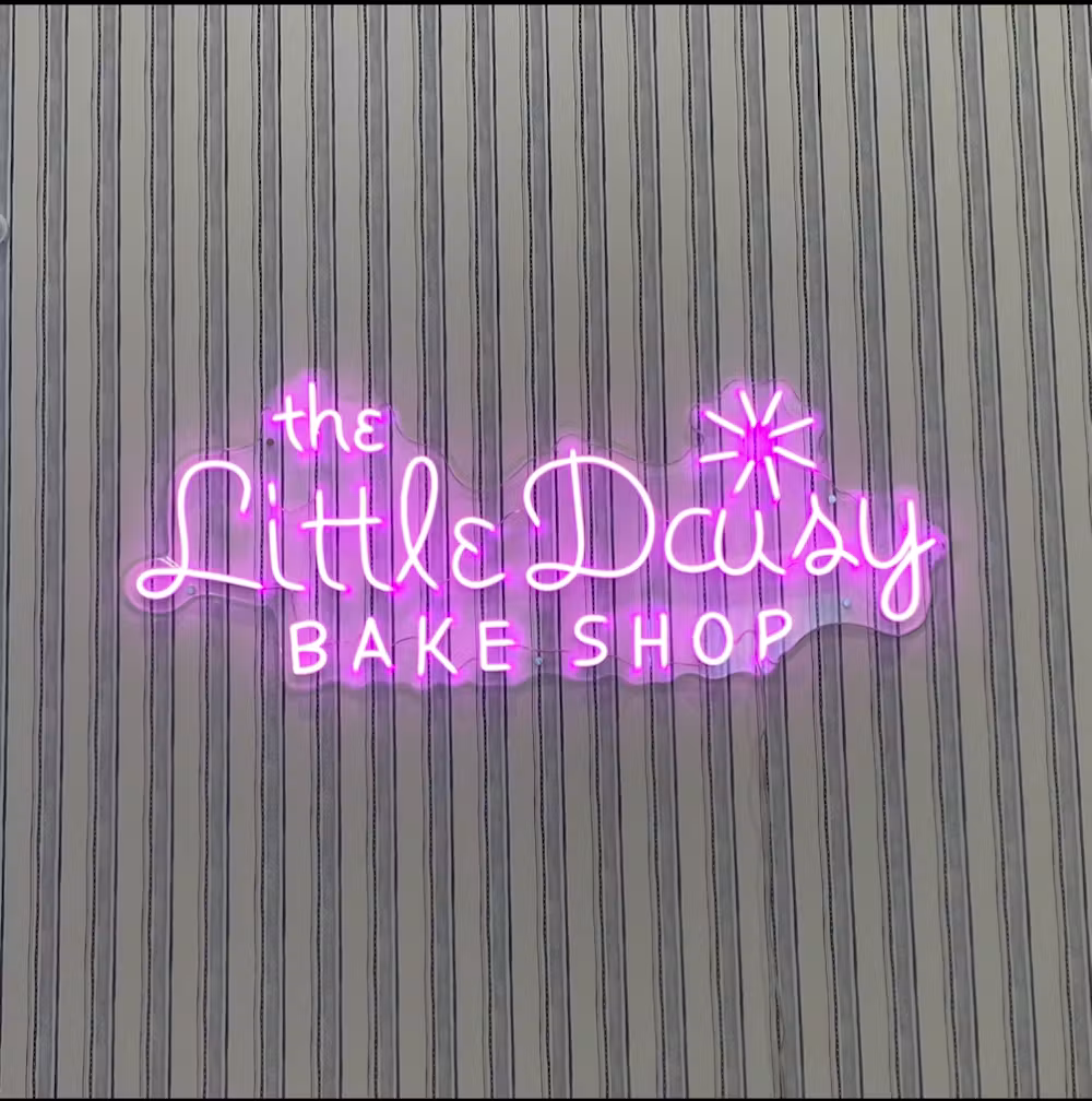 Little Daisy Bake Shop sign inside the bakery